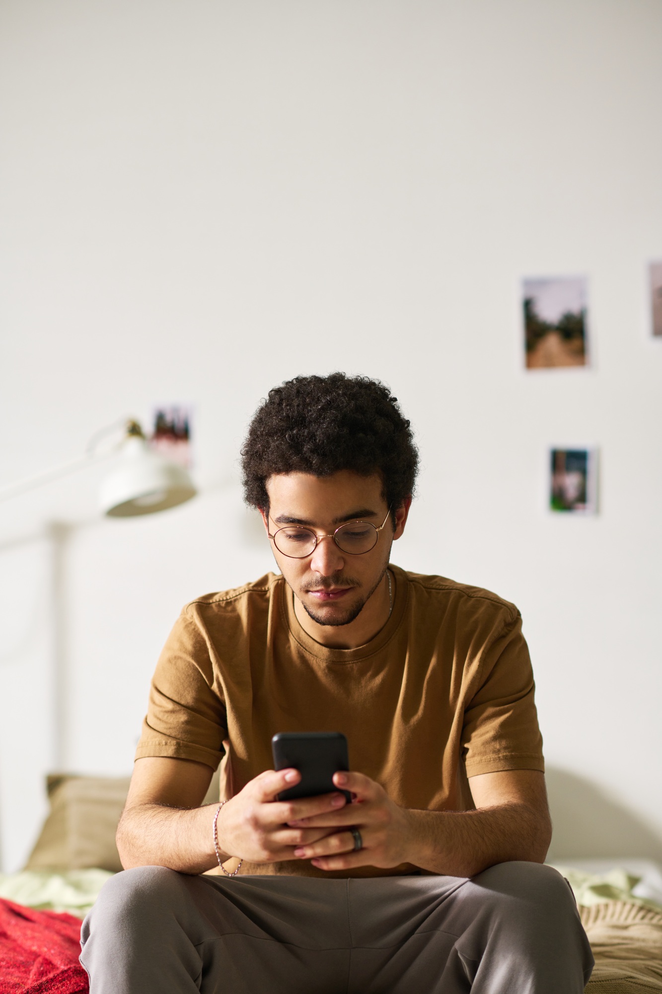 Man reading message with sad expression